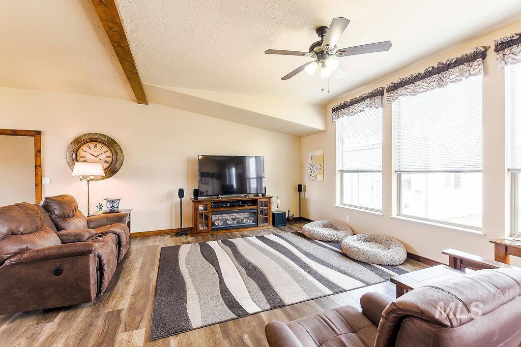 414 South Garfield Street Genesee, ID 83832 - Photo 17 of 50 Living area with a textured ceiling, wood finished floors, and a ceiling fan