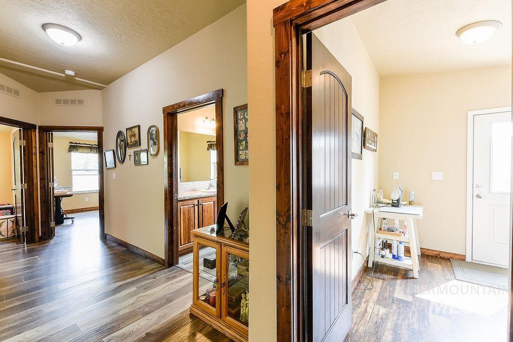 414 South Garfield Street Genesee, ID 83832 - Photo 32 of 50 Corridor featuring a textured ceiling and wood finished floors