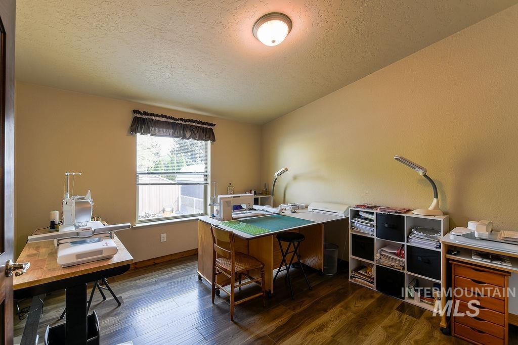 414 South Garfield Street Genesee, ID 83832 - Photo 37 of 50 Office area with dark wood finished floors and a textured ceiling