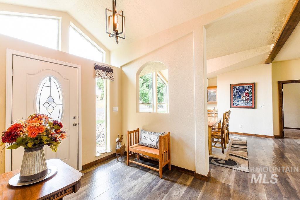 414 South Garfield Street Genesee, ID 83832 - Photo 4 of 50 Entrance foyer featuring wood finished floors and lofted ceiling