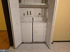 a view of a utility room with dryer and washer