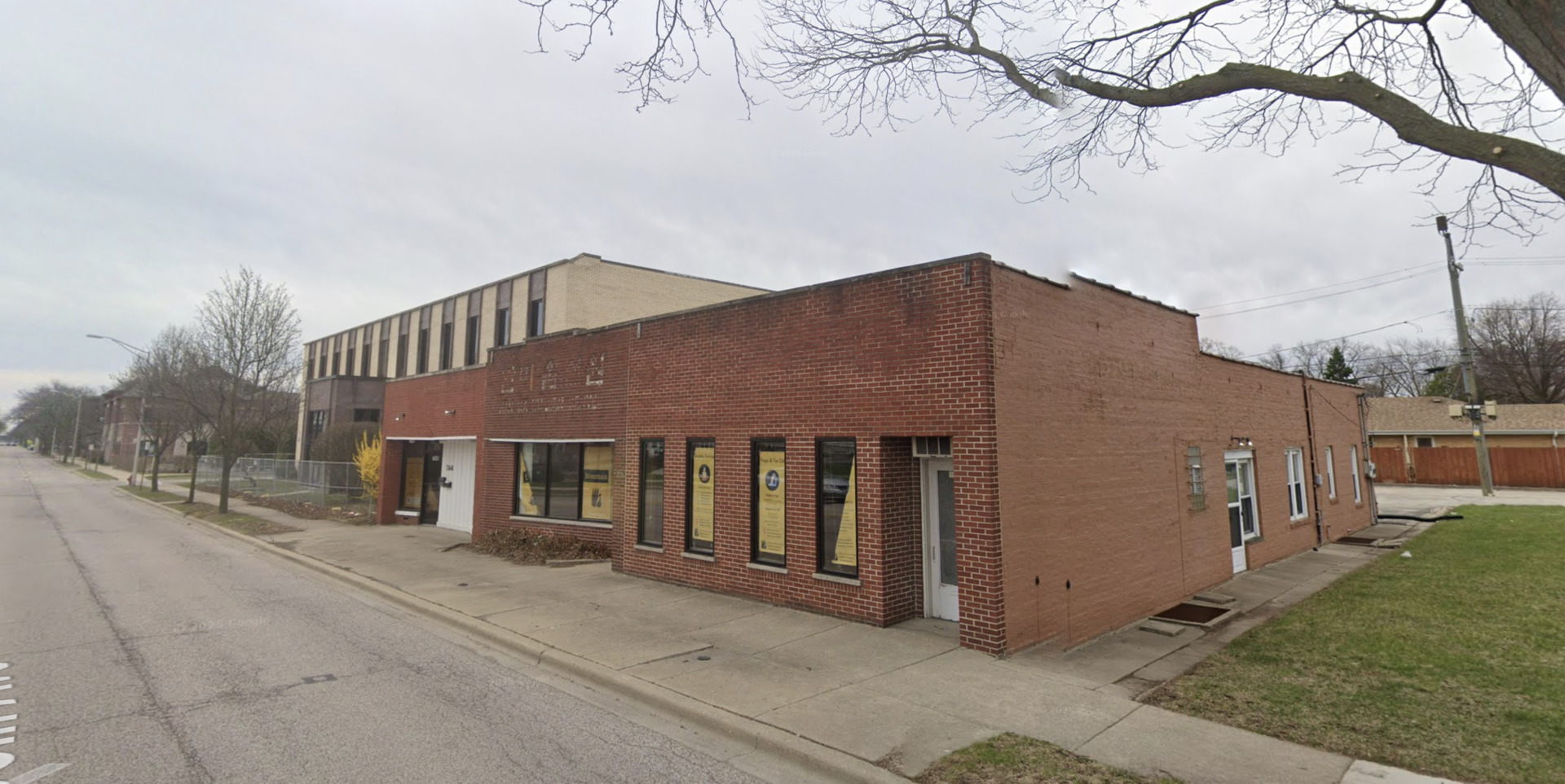 7848 Lincoln Avenue Skokie, IL 60077 - Photo 2 of 9 a front view of a house with a yard and garage