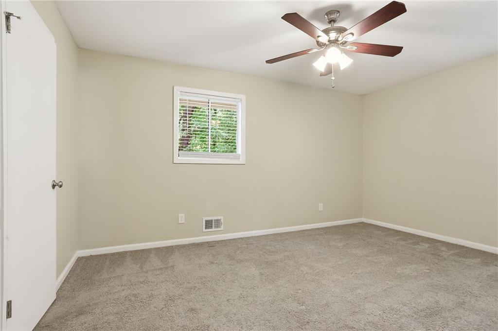 4505 Wonder Valley Trail Decatur, GA 30034 - Photo 16 of 34 an empty room with a window and a fan