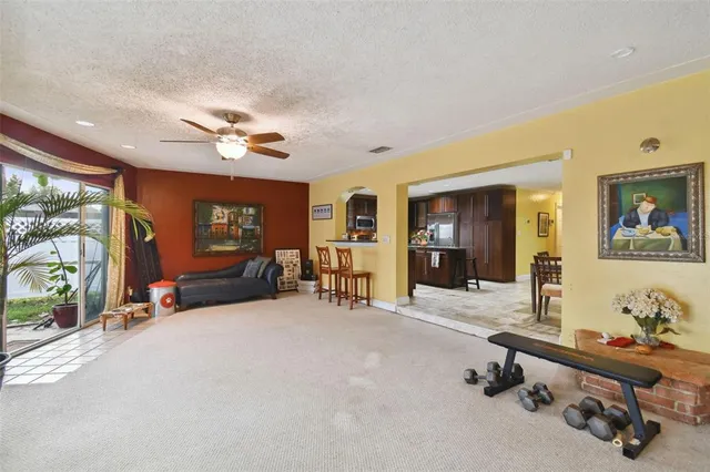a view of a livingroom with furniture and a flat screen tv