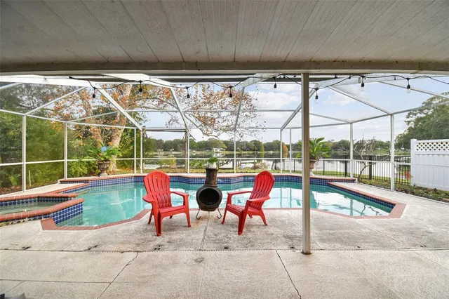 a view of swimming pool with outdoor seating