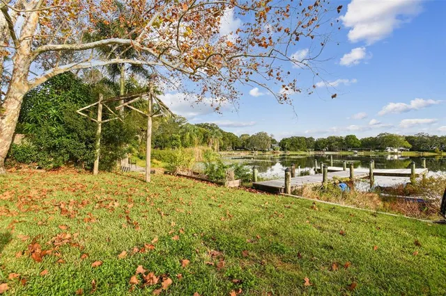 a view of a big yard with table and chairs