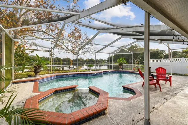 a view of swimming pool with seating area