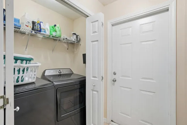 a utility room with dryer and washer
