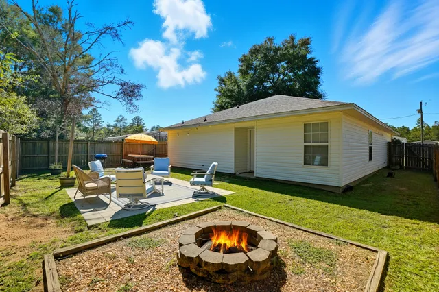 a view of a swimming pool with a patio