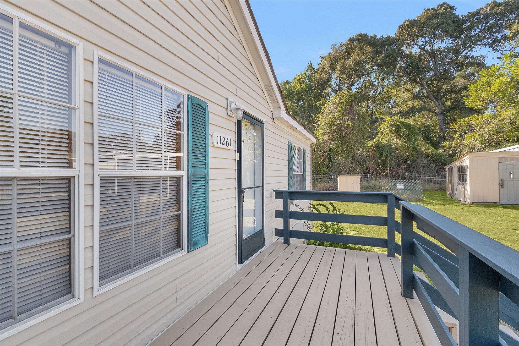 11261 Rose Road Conroe, TX 77303 - Photo 5 of 30 a view of outdoor space with deck and tall trees