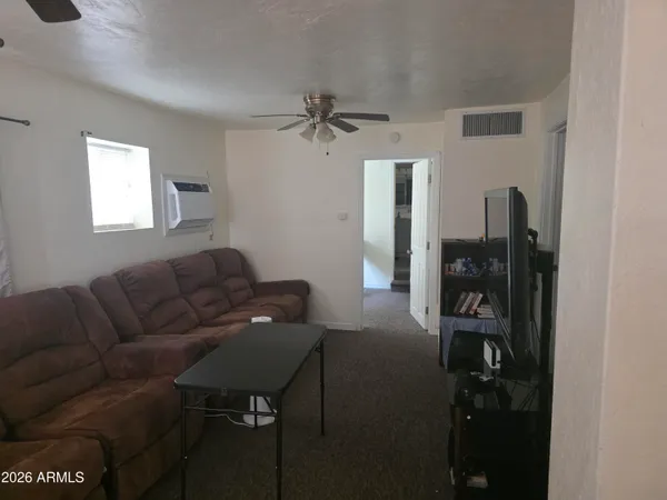 a living room with furniture and a window