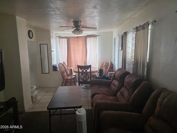a view of a livingroom with furniture and window