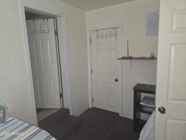 a view of bedroom with a closet