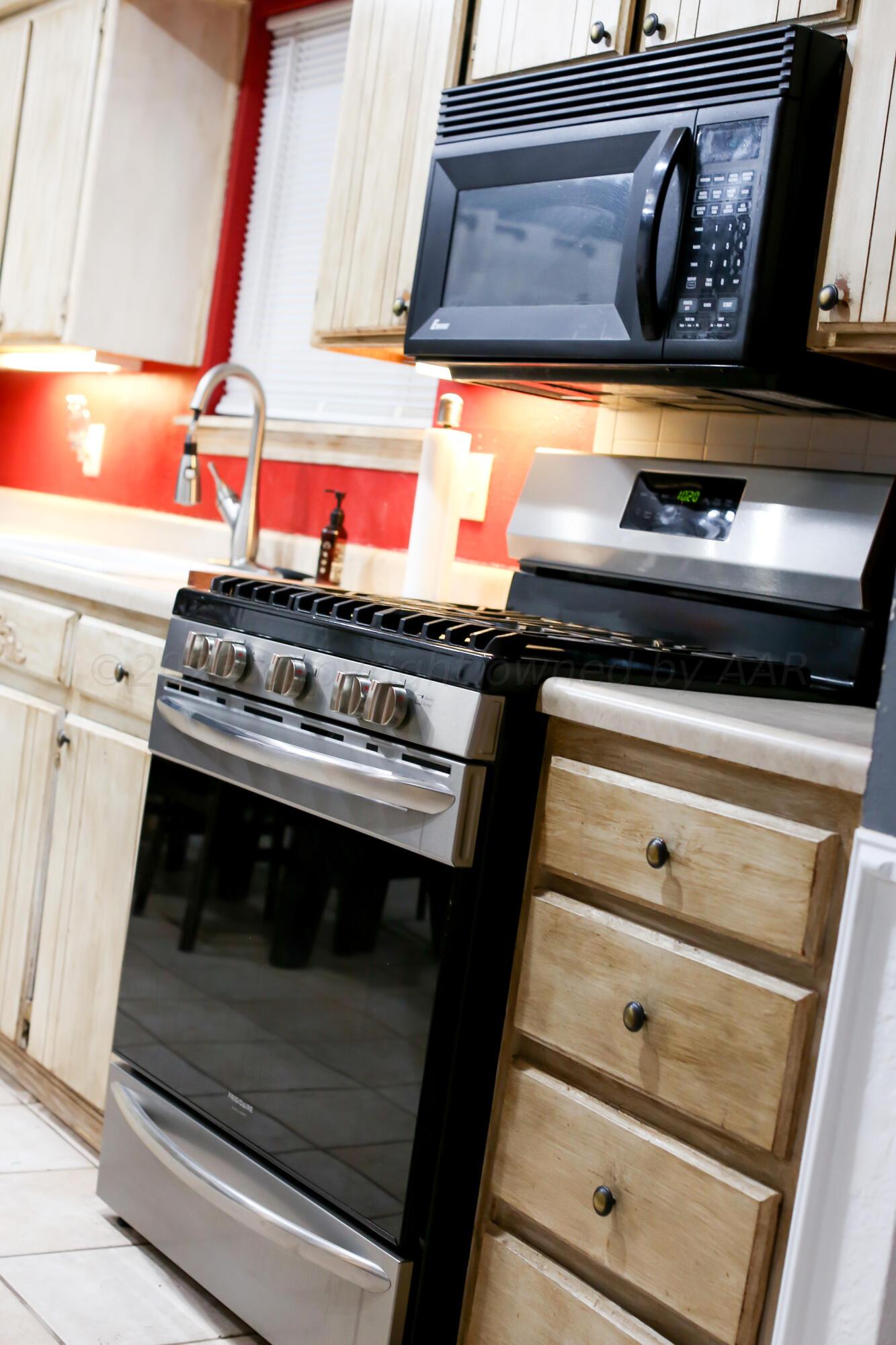 5317 Capulin Lane Amarillo, TX 79110 - Photo 11 of 19 a stove top oven sitting inside of a kitchen