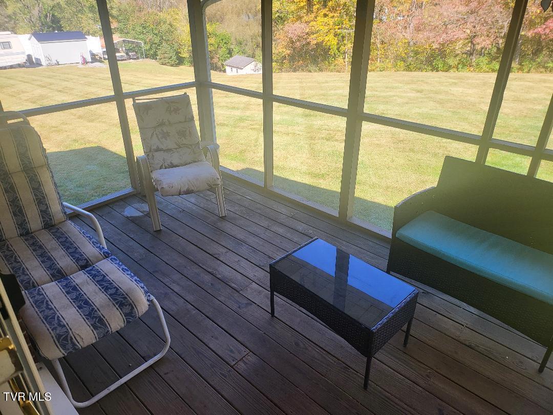 135 Unaka Subdivision Road Elizabethton, TN 37643 - Photo 6 of 21 Unaka Screened in porch 2