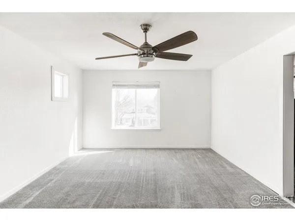 a view of empty room with windows