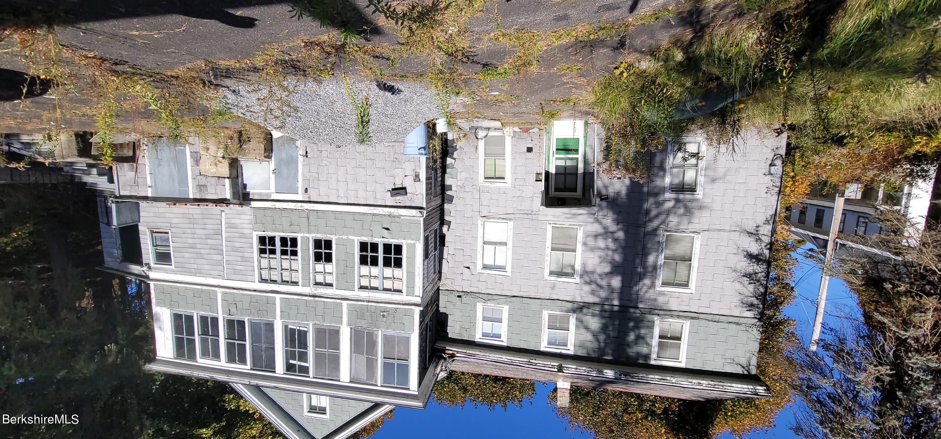 184 Prospect Street North Adams, MA 01247 - Photo 1 of 2 a front view of a residential apartment building with a yard