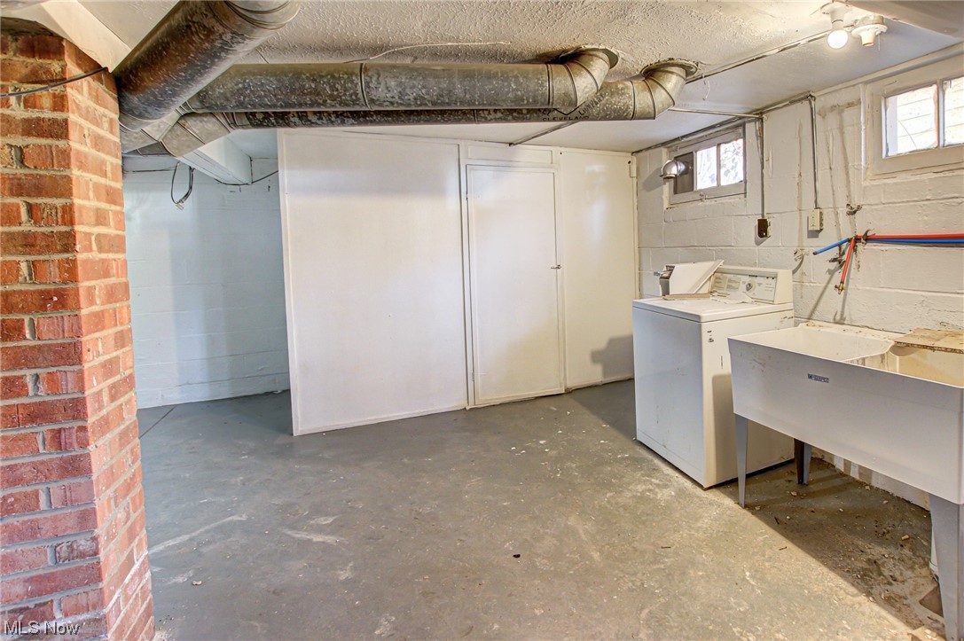 3423 Westbury Road Cleveland, OH 44120 - Photo 18 of 38 Basement with washer / dryer and brick wall
