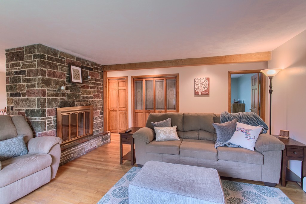 30 Center Street Ashburnham, MA 01430 - Photo 12 of 30 a living room with furniture and a fireplace
