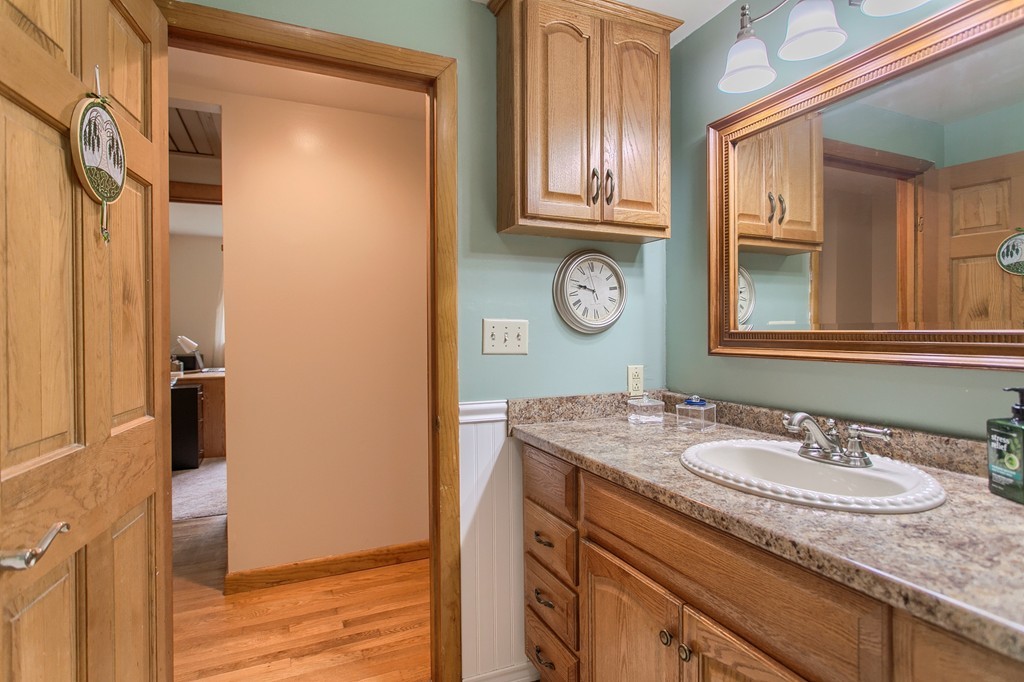 30 Center Street Ashburnham, MA 01430 - Photo 18 of 30 a bathroom with a granite countertop sink and a mirror