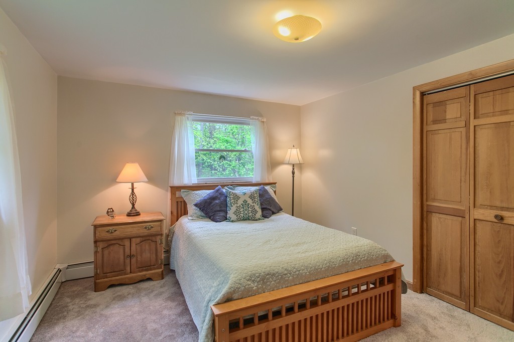 30 Center Street Ashburnham, MA 01430 - Photo 20 of 30 a bedroom with a bed and a window