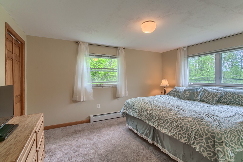 30 Center Street Ashburnham, MA 01430 - Photo 21 of 30 a bedroom with a bed and a window