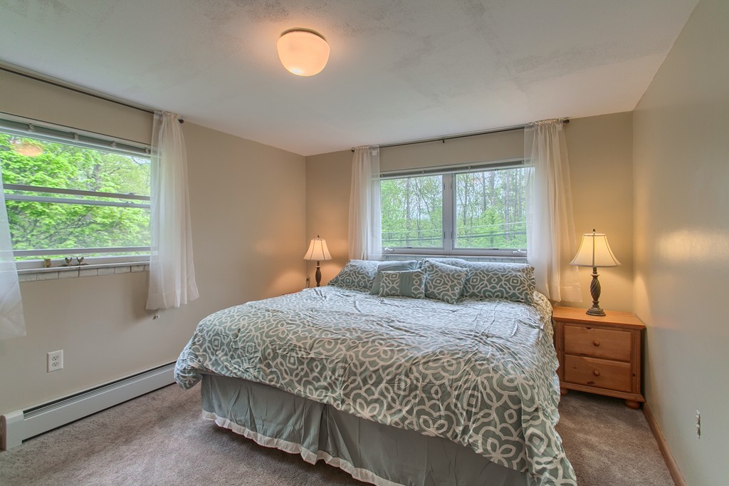 30 Center Street Ashburnham, MA 01430 - Photo 22 of 30 a bedroom with a bed and window