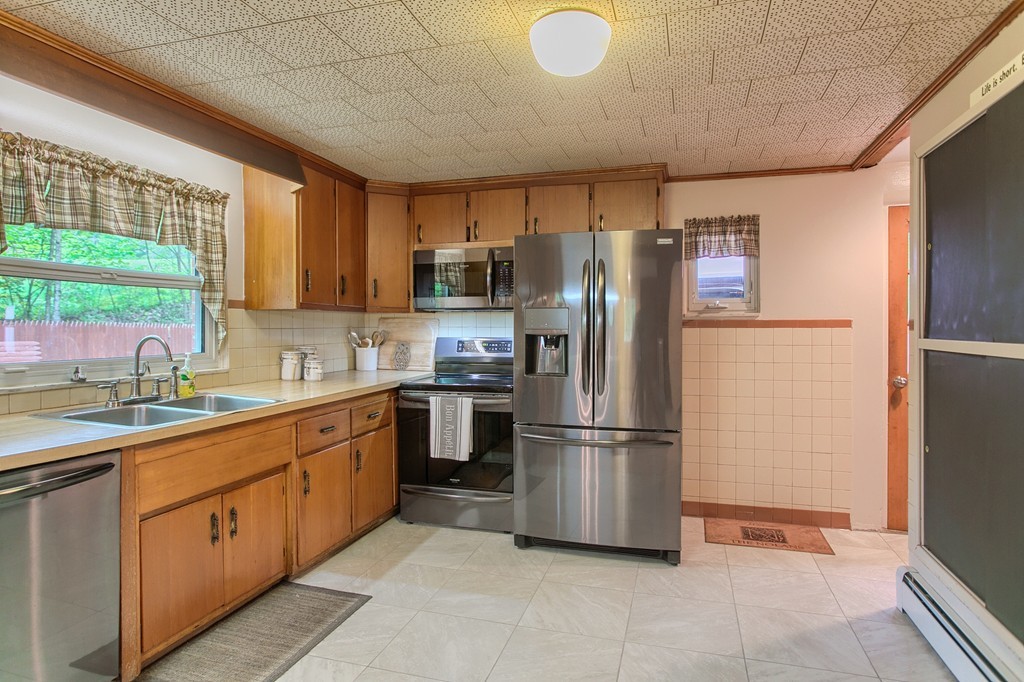 30 Center Street Ashburnham, MA 01430 - Photo 7 of 30 a kitchen with stainless steel appliances granite countertop a refrigerator sink and cabinets