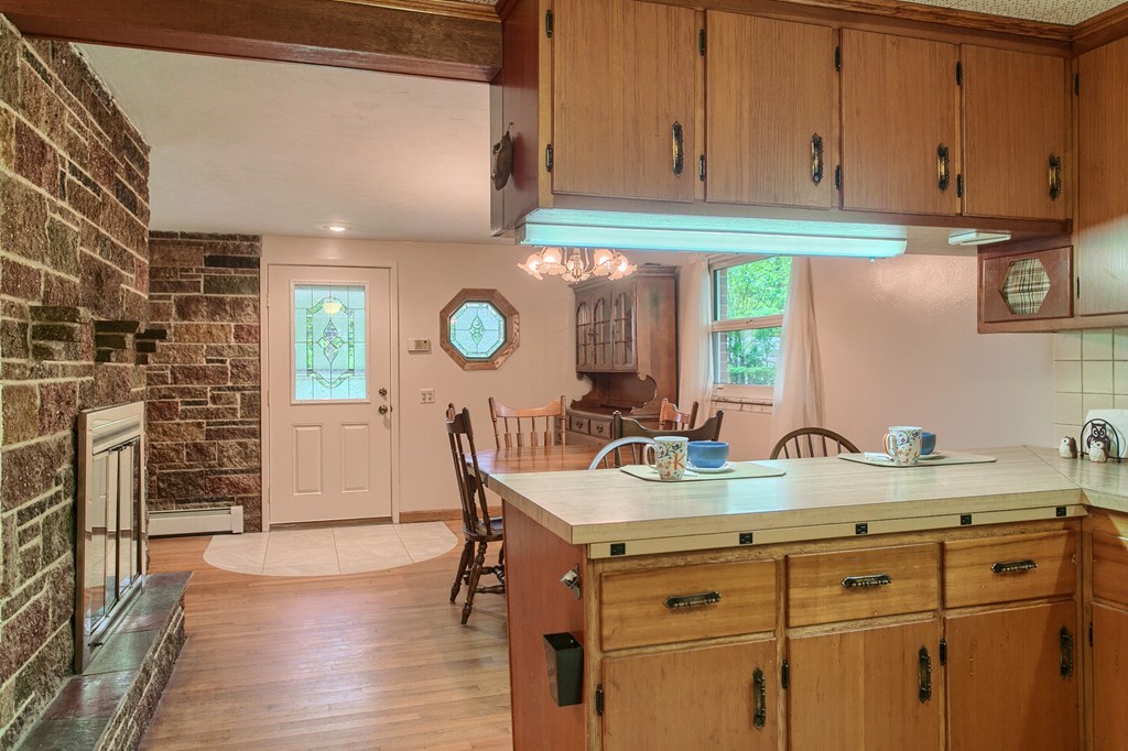 30 Center Street Ashburnham, MA 01430 - Photo 9 of 30 a kitchen with a sink cabinets and wooden floor