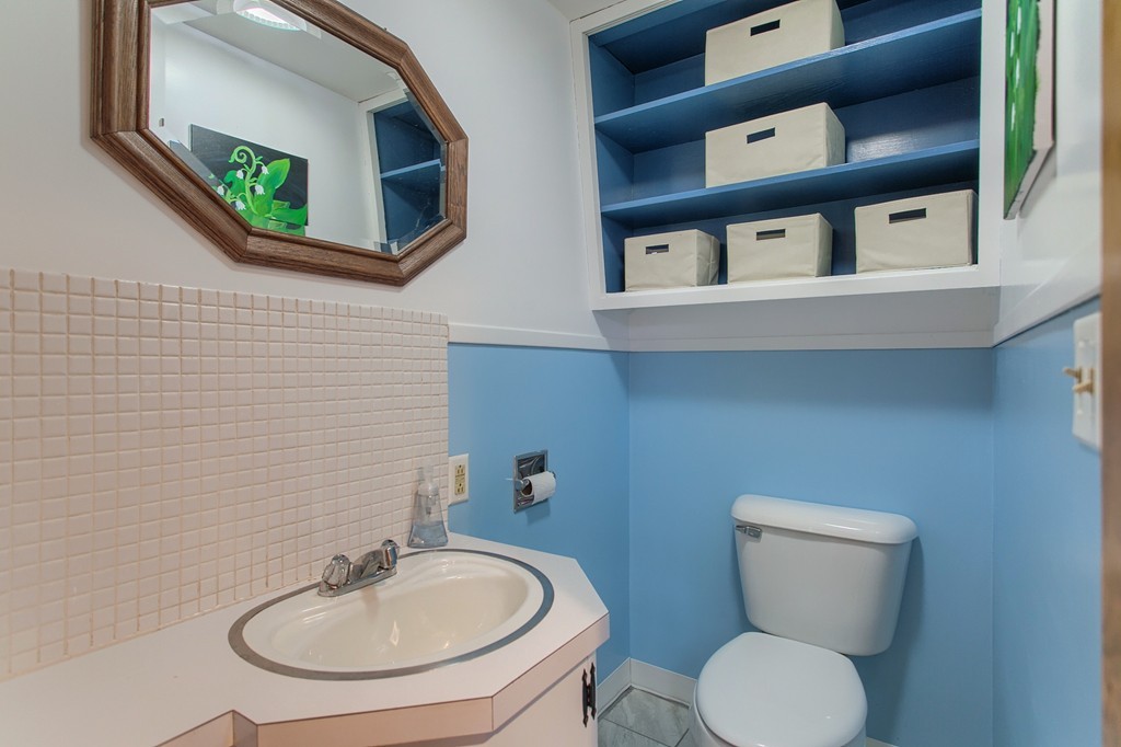 30 Center Street Ashburnham, MA 01430 - Photo 10 of 30 a bathroom with a toilet a sink and mirror