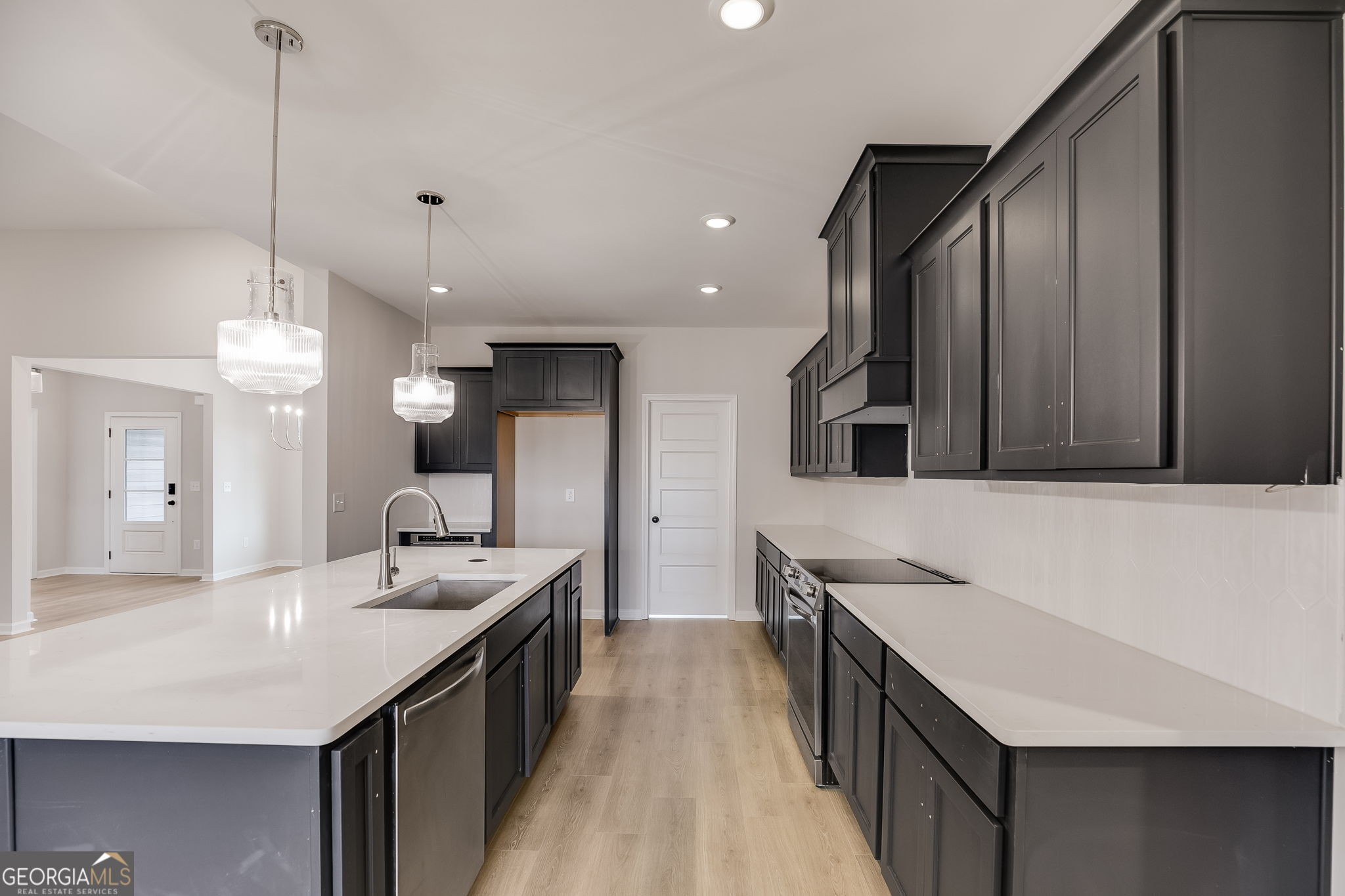 3356 Veal Road Roopville, GA 30170 - Photo 12 of 45 a kitchen with a sink a counter space and stainless steel appliances