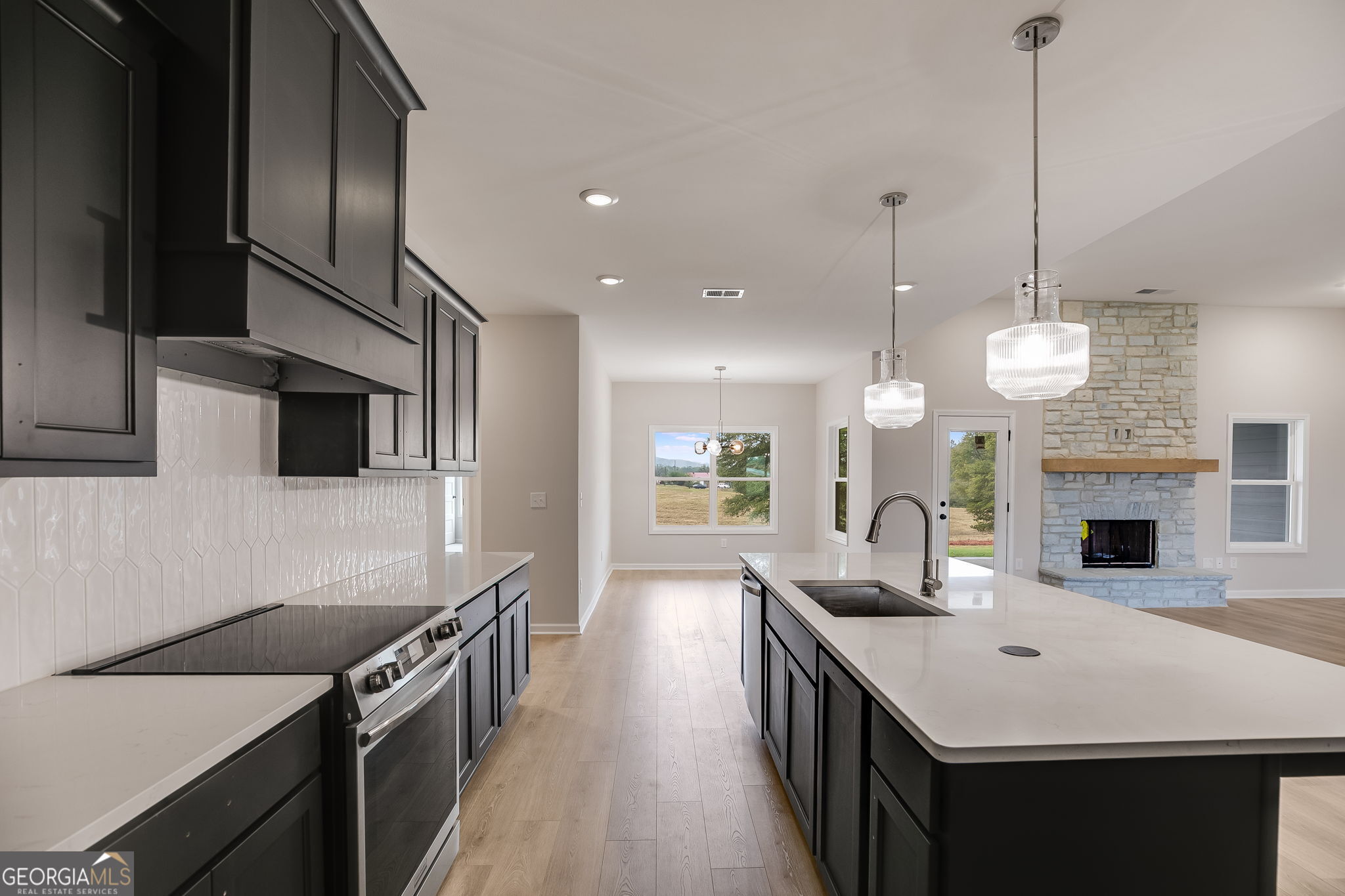 3356 Veal Road Roopville, GA 30170 - Photo 14 of 45 a kitchen with sink stove and refrigerator