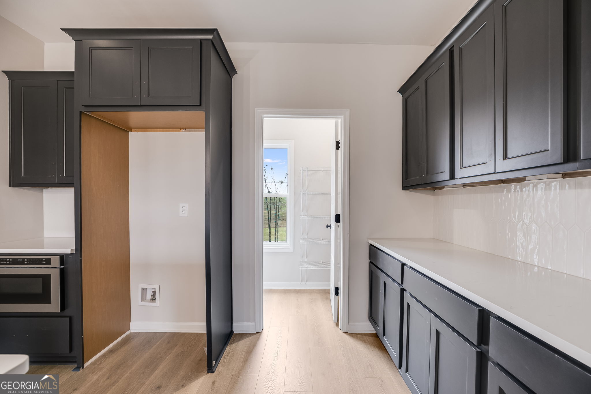 3356 Veal Road Roopville, GA 30170 - Photo 15 of 45 a kitchen with a refrigerator sink and cabinets