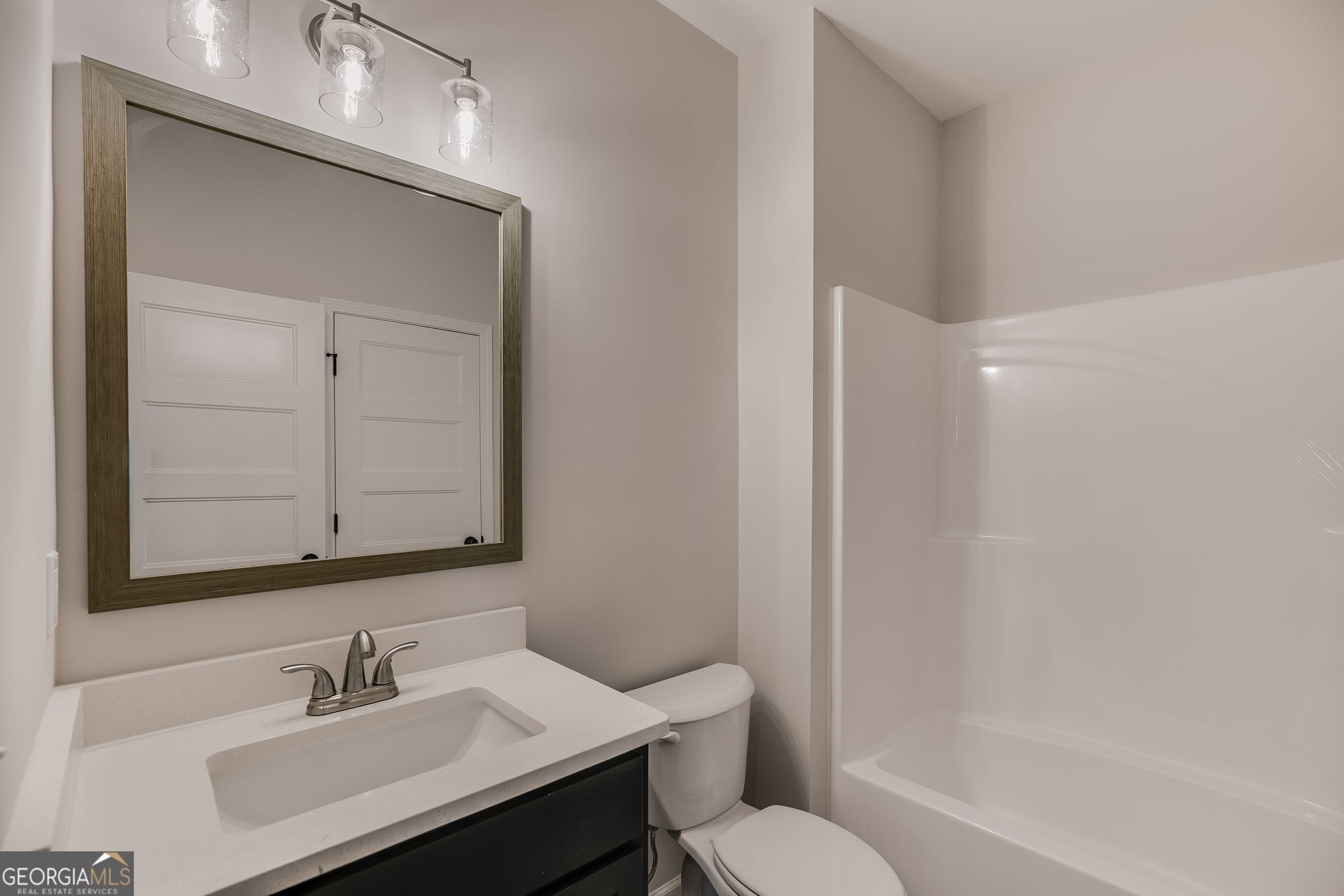 3356 Veal Road Roopville, GA 30170 - Photo 20 of 45 a bathroom with a sink toilet and shower