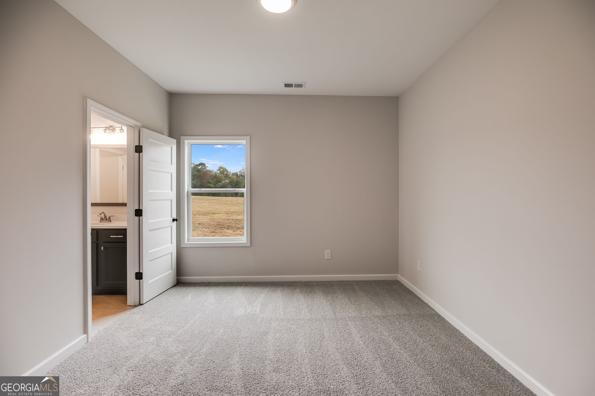 3356 Veal Road Roopville, GA 30170 - Photo 28 of 45 a view of an empty room with a window