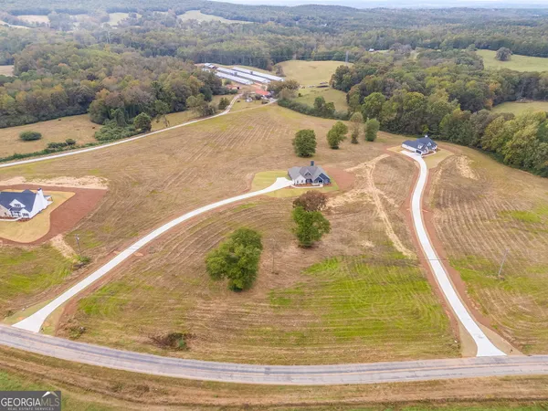 a view of a hallway view with wooden floor and staircase