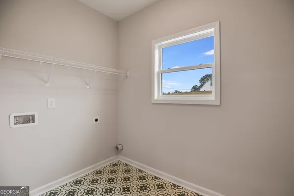 an empty room with a empty space and window