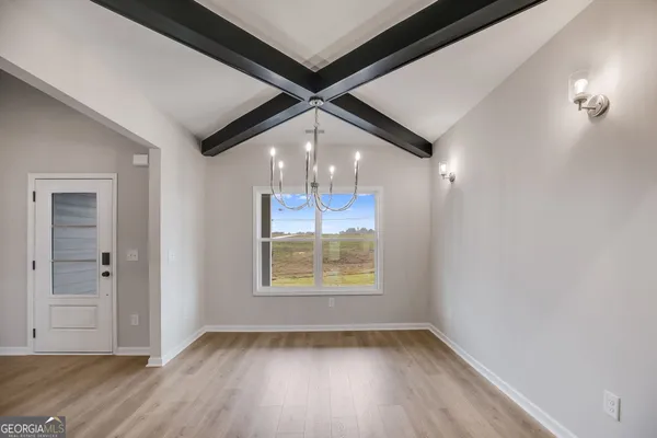 a view of kitchen with furniture and a ceiling fan