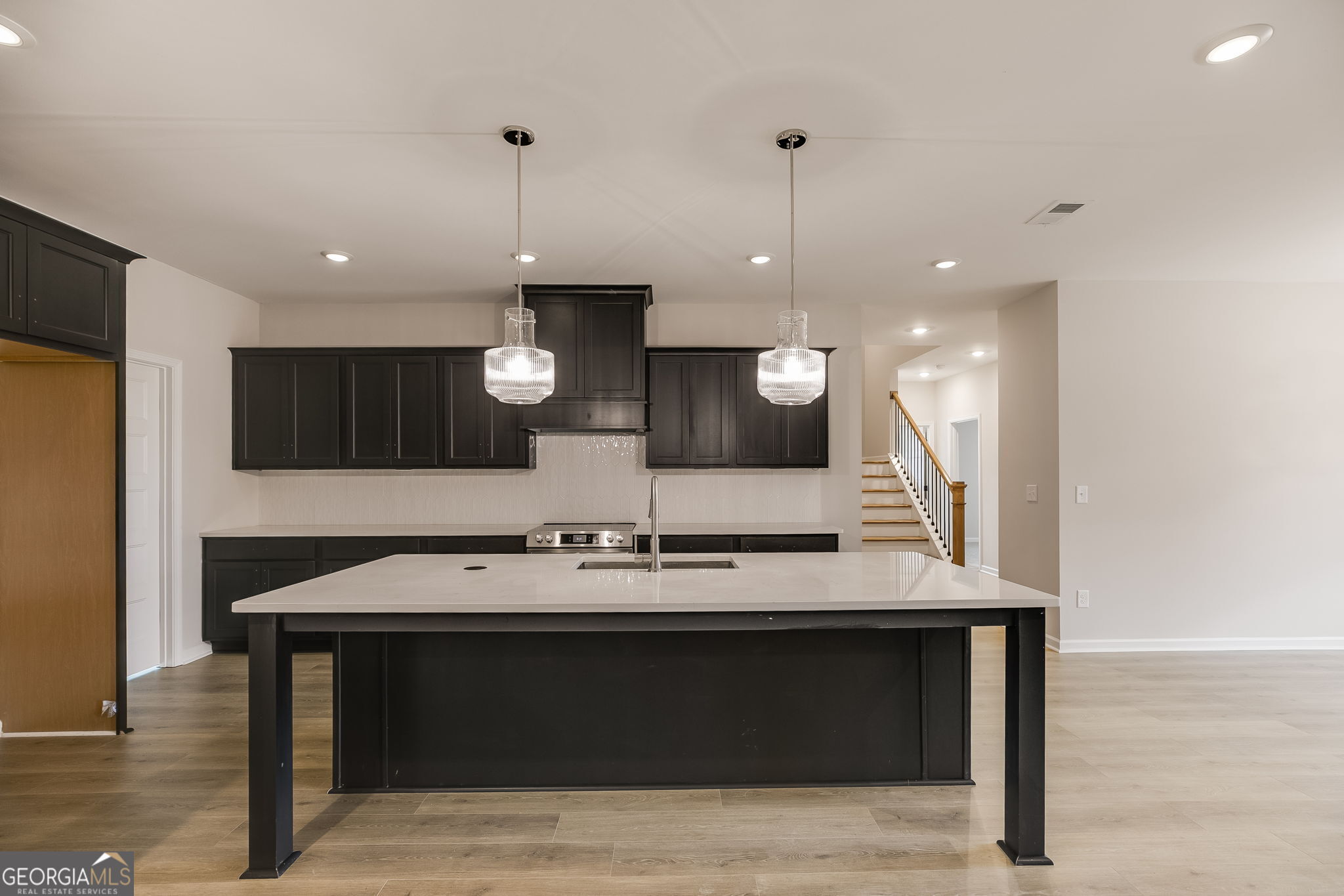 3356 Veal Road Roopville, GA 30170 - Photo 10 of 45 a kitchen with a sink cabinets and wooden floor