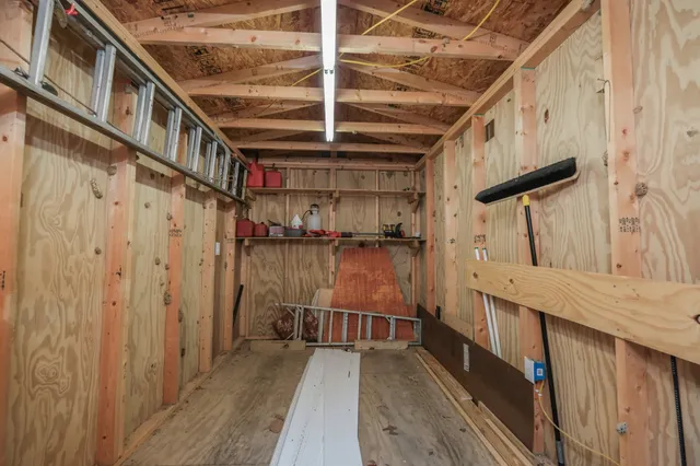 a view of balcony with wooden floor and wardrobe