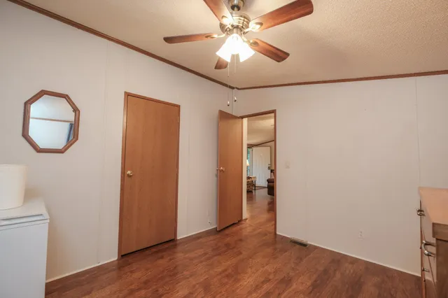 a view of an entryway with wooden floor