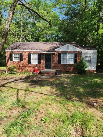 a front view of house with yard swimming pool and seating space