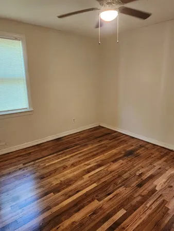 a view of room with wooden floor