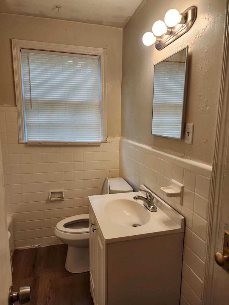 2444 South Lumpkin Road Columbus, GA 31903 - Photo 20 of 21 a bathroom with a sink a toilet and mirror
