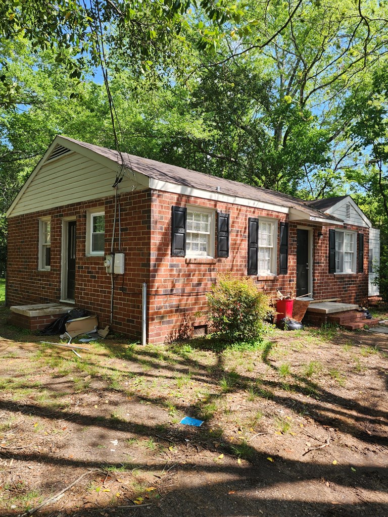 2444 South Lumpkin Road Columbus, GA 31903 - Photo 2 of 21 a view of a house with backyard and sitting area