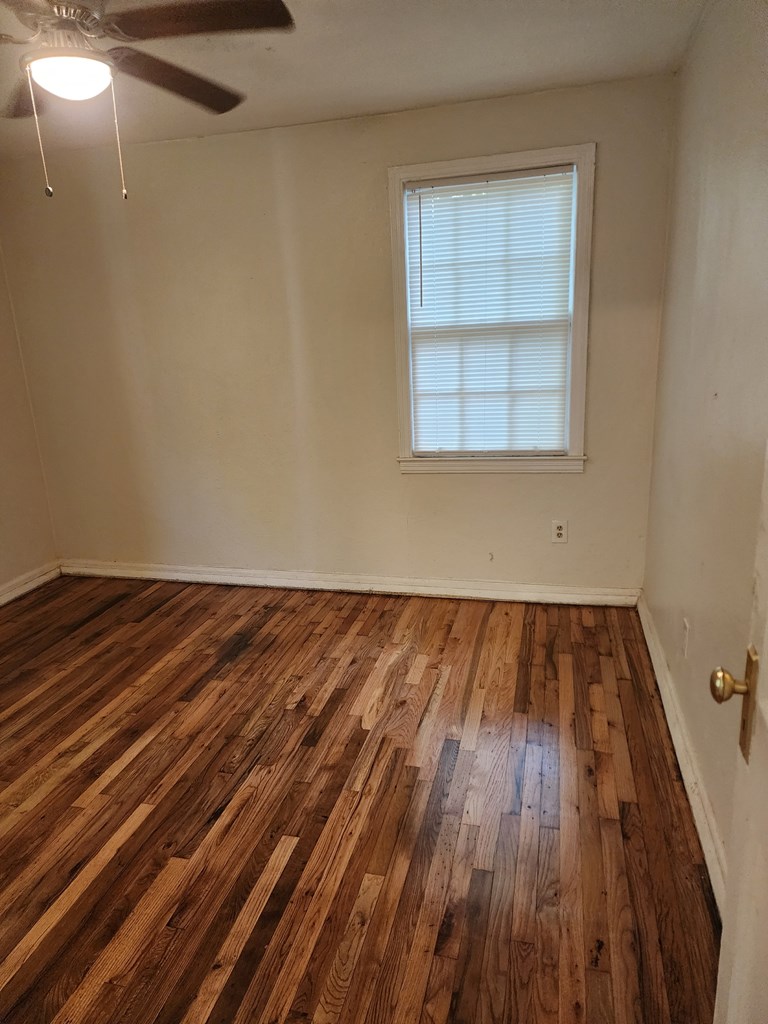 2444 South Lumpkin Road Columbus, GA 31903 - Photo 9 of 21 a view of a room with wooden floor and window