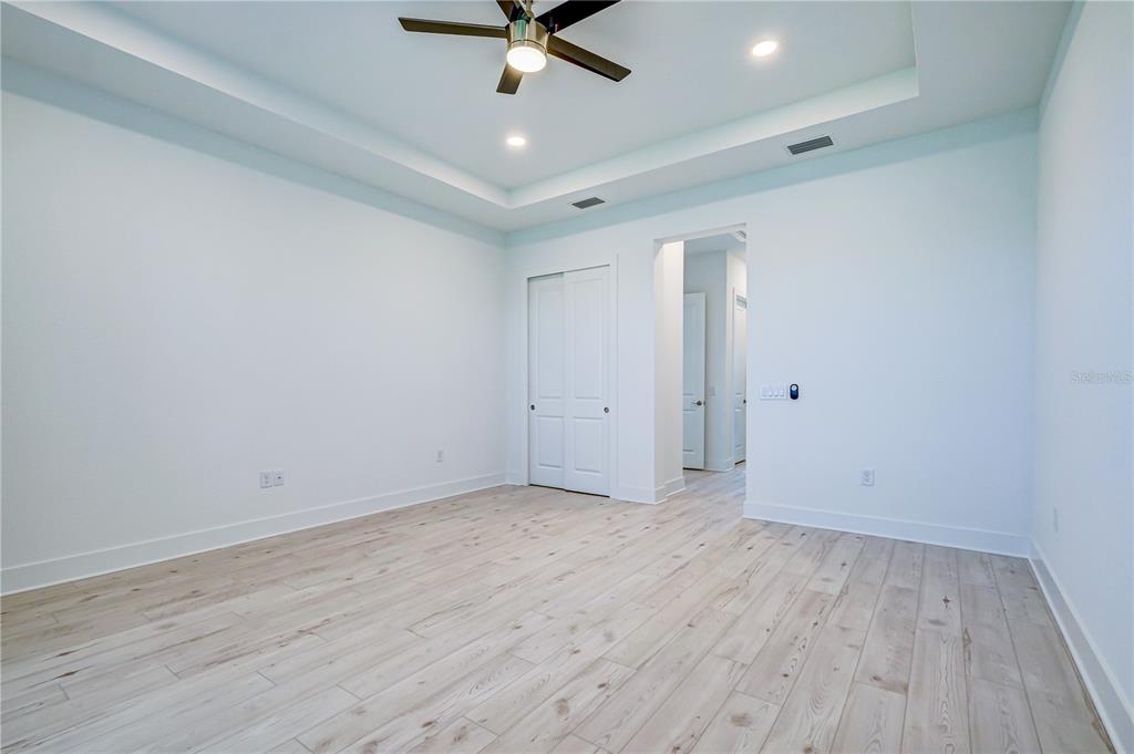 8218 Nevis Run Lakewood Ranch, FL 34202 - Photo 18 of 48 wooden floor in an empty room