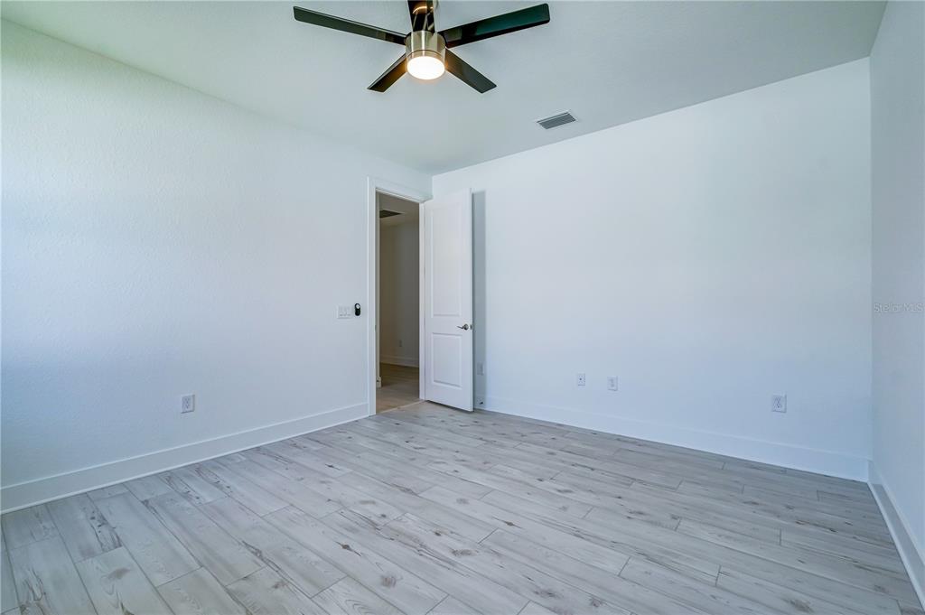8218 Nevis Run Lakewood Ranch, FL 34202 - Photo 23 of 48 a view of a room with wooden floor