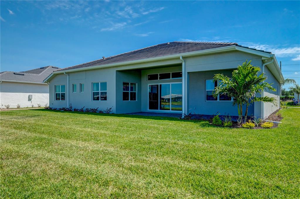 8218 Nevis Run Lakewood Ranch, FL 34202 - Photo 34 of 48 a view of a house with a garden