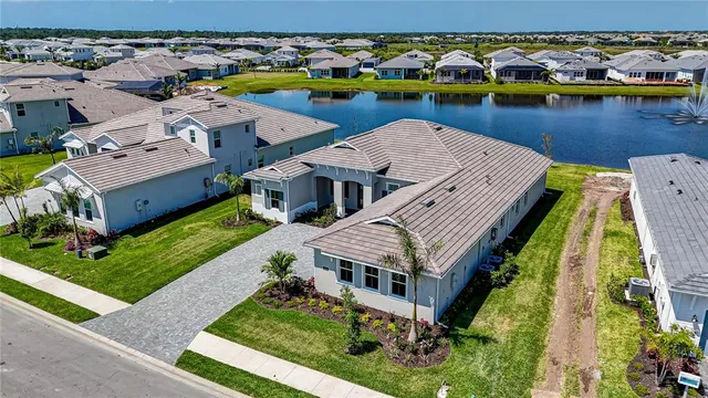 an aerial view of a house with a lake view